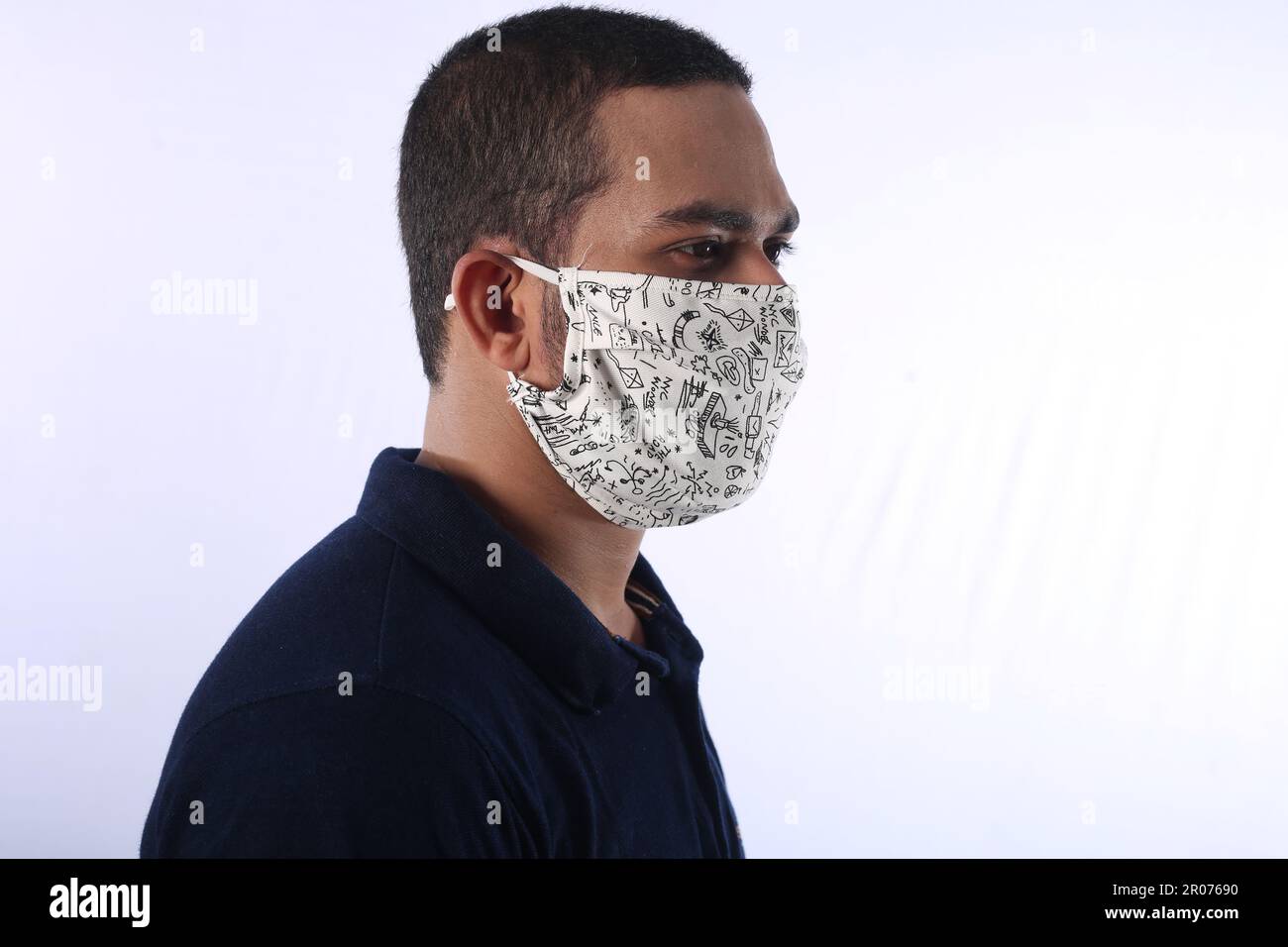 locally made hand crafted floral face mask while serving customers in the  town deli in Presteigne Stock Photo - Alamy