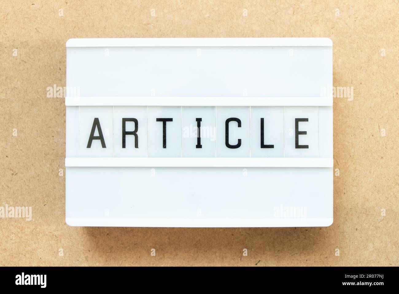 Lightbox with word article on wood background Stock Photo