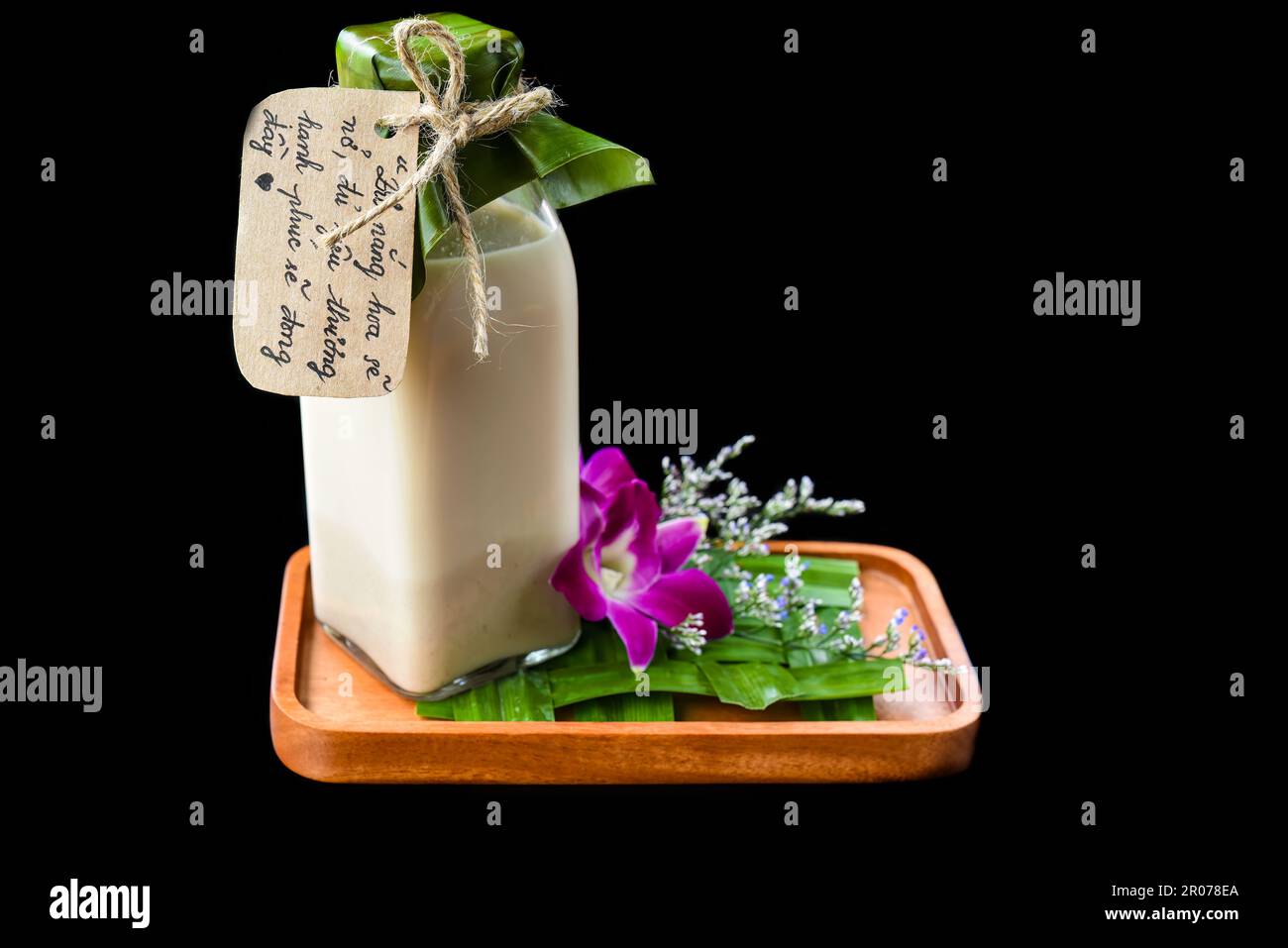 Vietnamese yogurt with flowers and sign with vietnamese text in