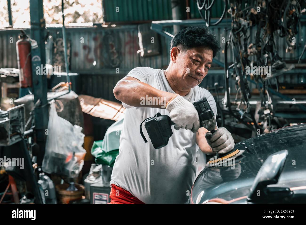 Auto mechanic diagnose and troubleshoots with tools and equipment