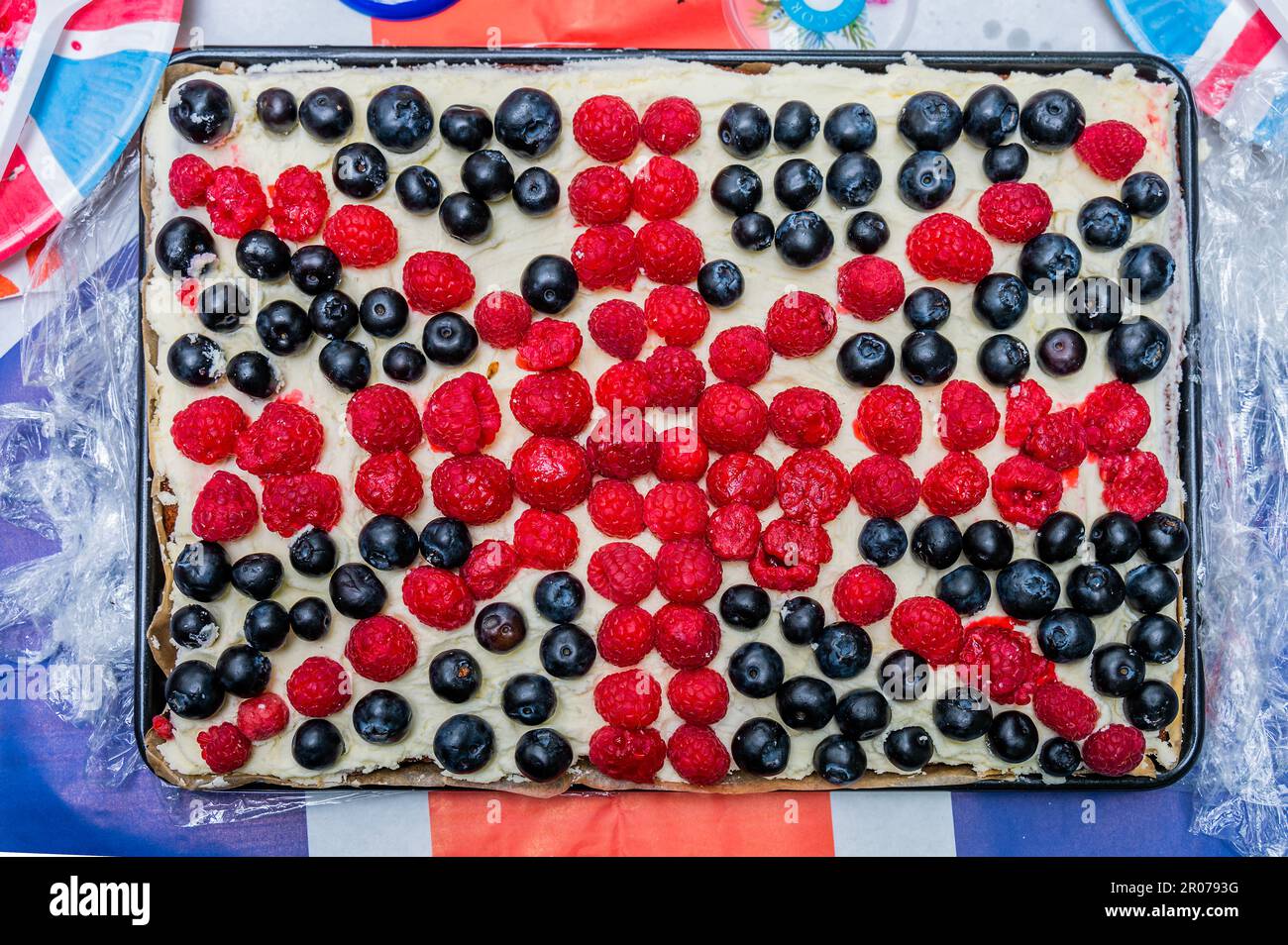 London, UK. 7th May, 2023. A union Jack fruit tart The Big Lunch on