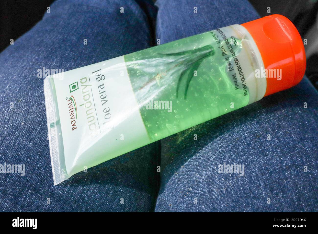 Female holding Aloe vera gel cream from Patanjali Brand for beauty care  cosmetic during travel. Patanjali aloe vera cream Stock Photo - Alamy