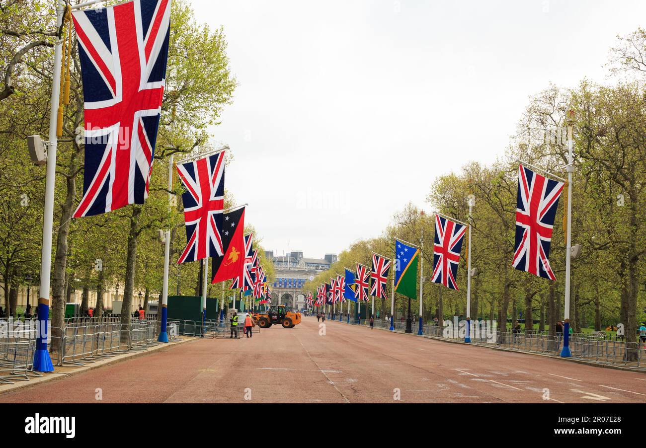 The Mall near Buckingham Palace looking towards Admiralty Arch with flags flying in celebration of King Charles III Coronation Stock Photo
