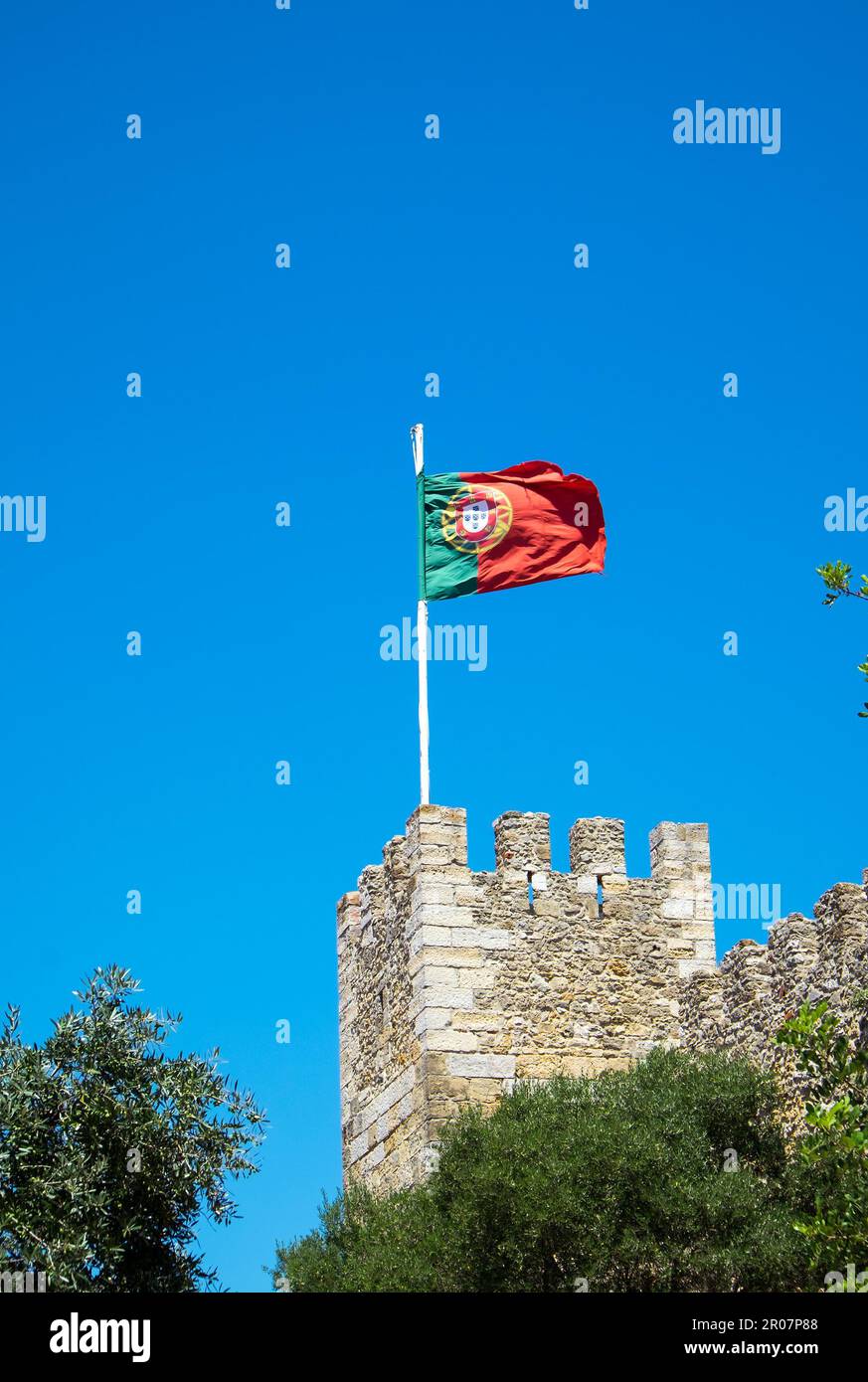 The Portuguese flag whet on an old castle Stock Photo