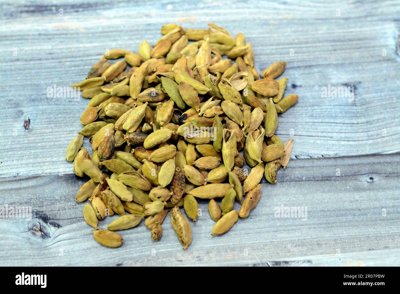 Cardamom, cardamon or cardamum, a spice made from the seeds of several plants in the genera Elettaria and Amomum in the family Zingiberaceae, used in Stock Photo