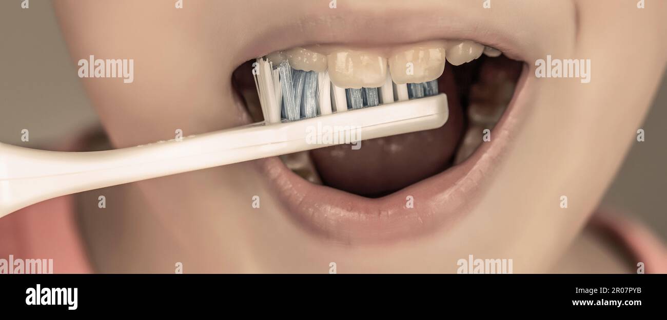 Little boy cleaning teeth. Dental hygiene. Happy little kid brushing her teeth. Kid boy brushing teeth. Boy toothbrush white toothpaste. Health care Stock Photo