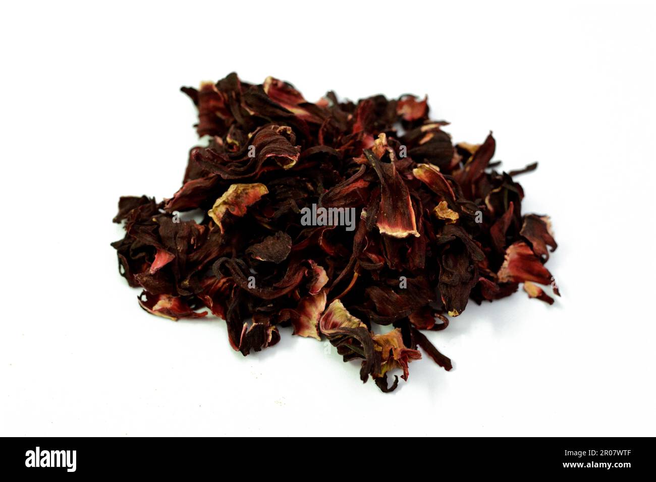 Dried Roselle herbs isolated, a dark red-purple colored bissap wonjo natural herbs, flowers of the Roselle plant Hibiscus used to prepare Roselle Juic Stock Photo