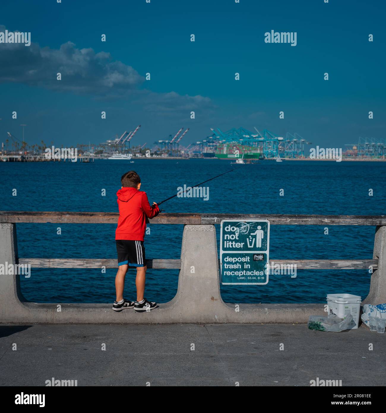 a little boy fishing at the Cabrillo Beach Pier Stock Photo