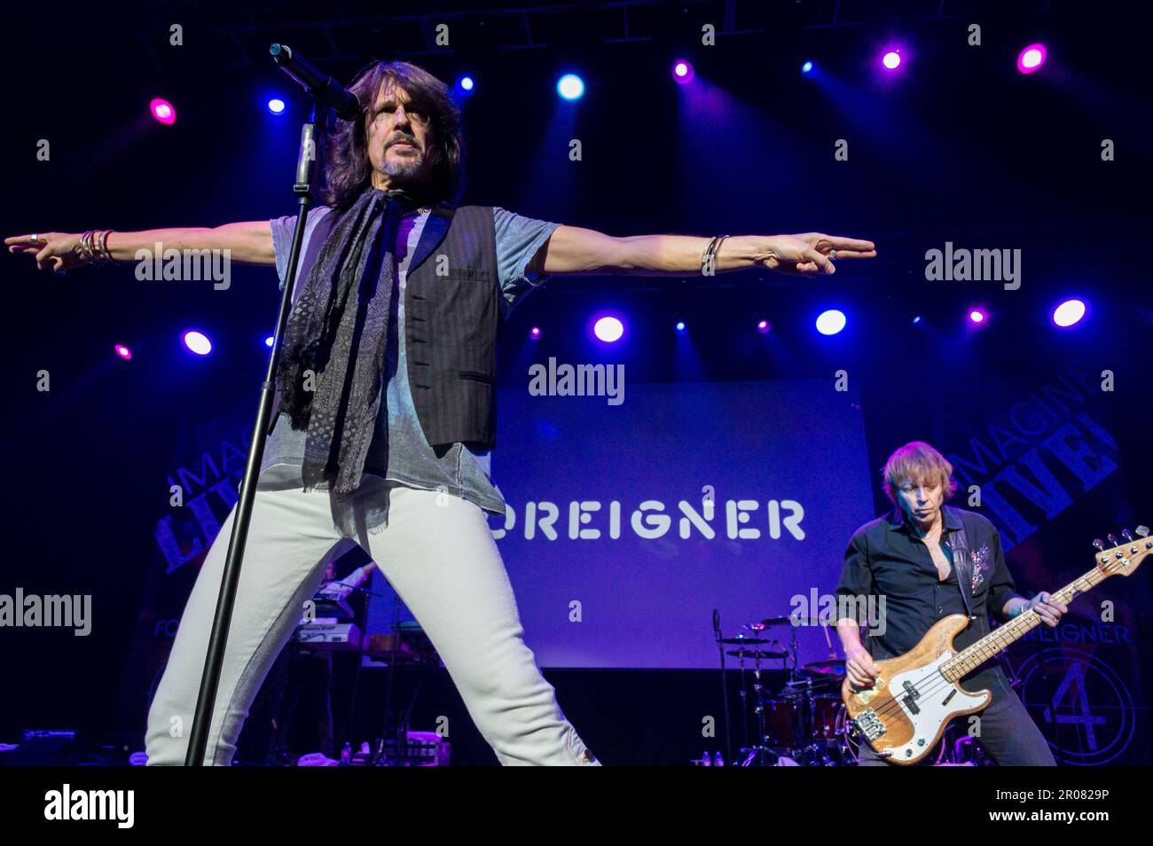12 April, 2015, Las Vegas, Nevada: Vocalist Kelly Hansen (left) and bassist Jeff Pilsen perform with Foreigner at a corporate show. Stock Photo