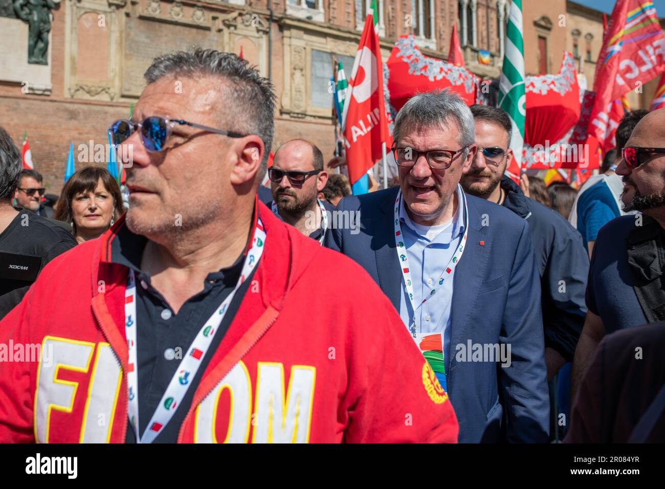 Bologna, Italy. 06th May, 2023. Maurizio Landini, the general secretary of the CGIL goes towards the stage preceded by a FIOM worker before his speech during the trade union demonstration. 30,000 workers took to the streets in Bologna in the demonstration organized by the confederal trade unions CGIL (Italian General Confederation of Labour), CISL (Italian Confederation of Trades Unions), UIL (Italian Labour Union) to protest against the Meloni government's work decree. Elly Schlein was disputed by some UIL workers to avoid politicizing of a workers' demonstration. During the intervention from Stock Photo
