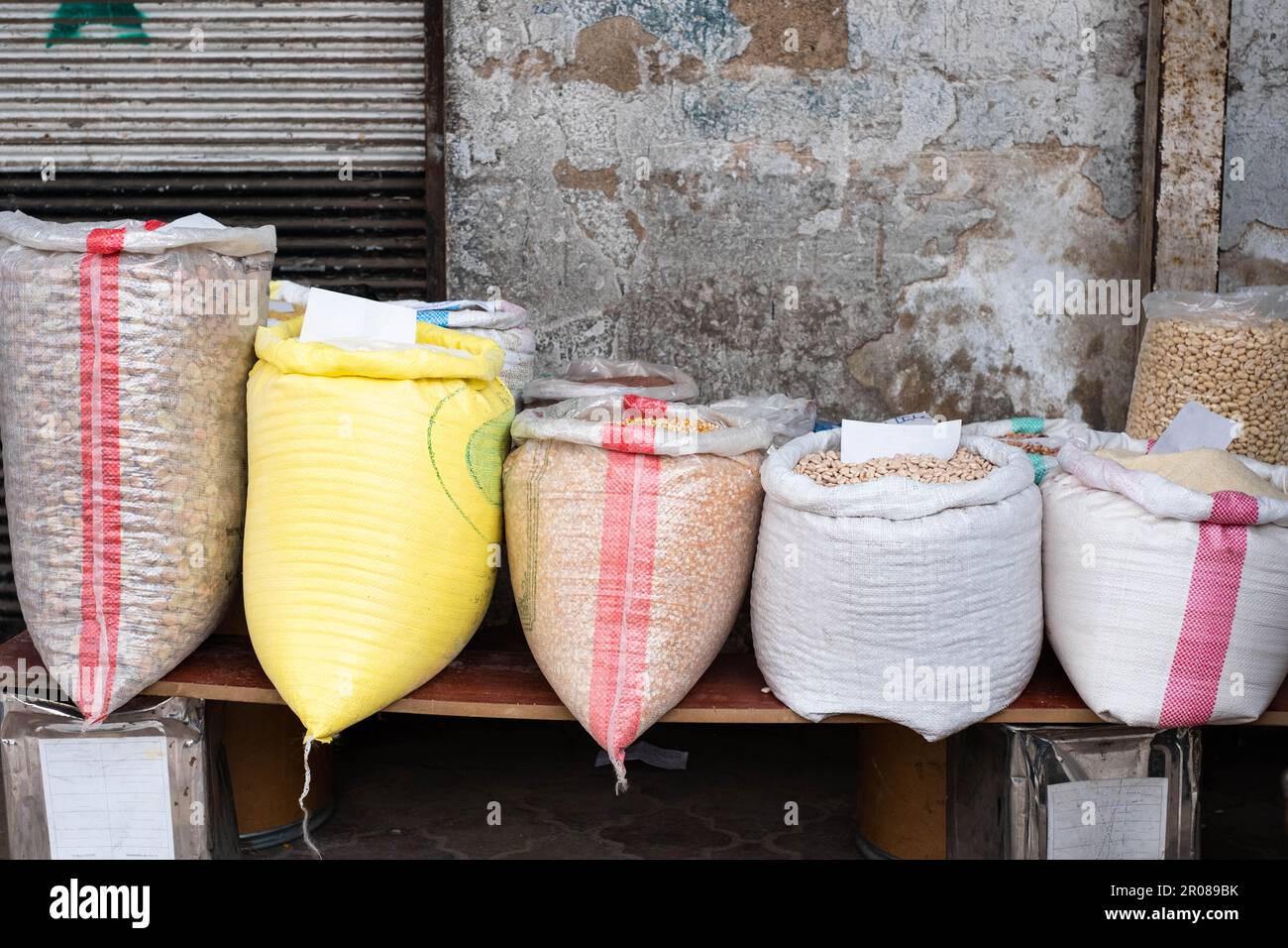 Bags of food, almonds, nuts, corn and flour on street market Stock Photo