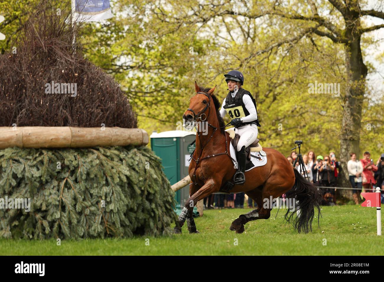 Badminton, UK. 07th May, 2023. Greta Mason riding Cooley For Sure clears fence 13 during the Cross Country on Day three of the Badminton Horse Trials at Badminton, Gloucester, UK on 7 May 2023. Photo by Ken Sparks. Editorial use only, license required for commercial use. No use in betting, games or a single club/league/player publications. Credit: UK Sports Pics Ltd/Alamy Live News Stock Photo