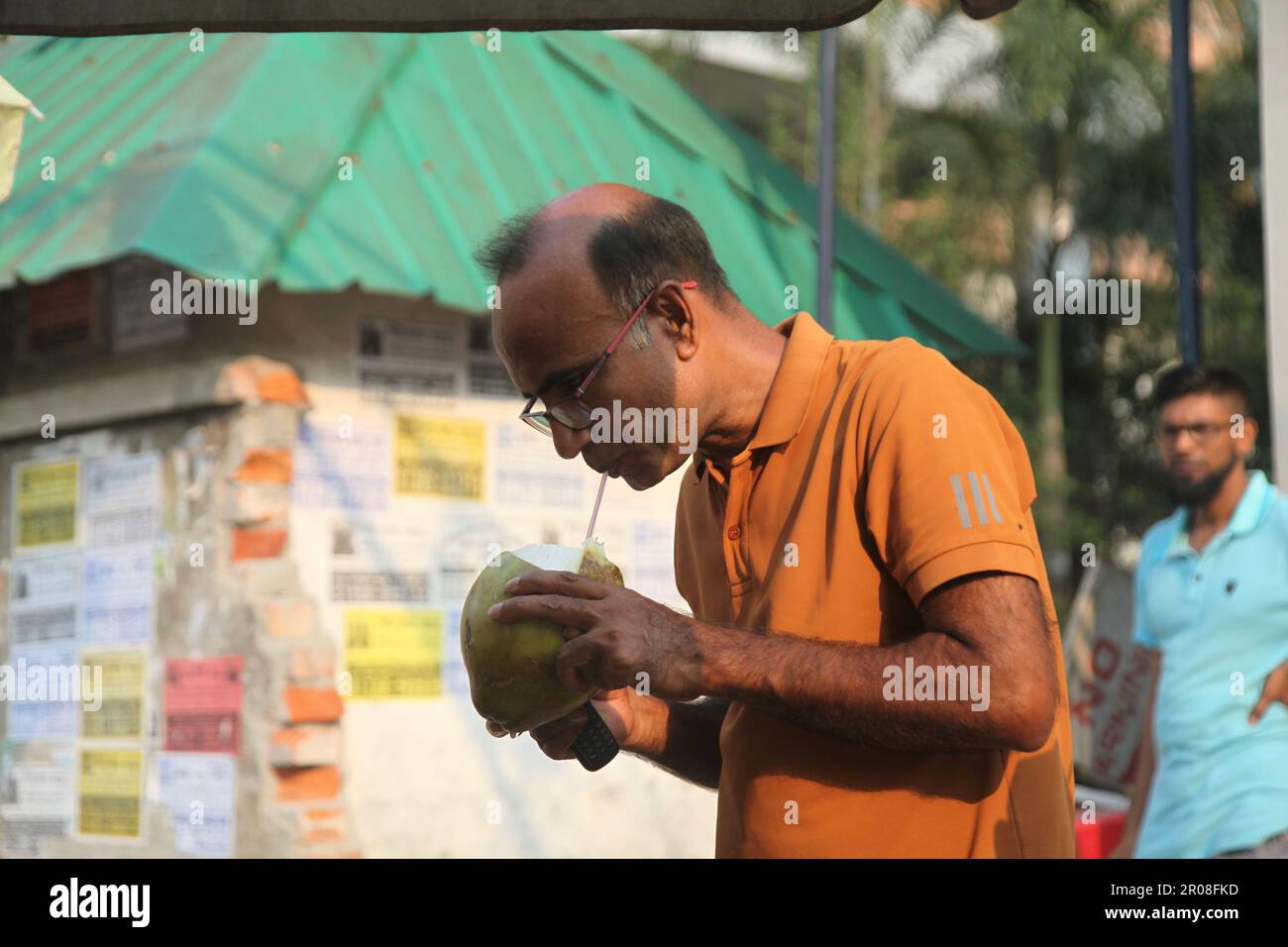 Coconut water in summer.07may,2023 dhaka bangladesh.Coconut water is considered as natural