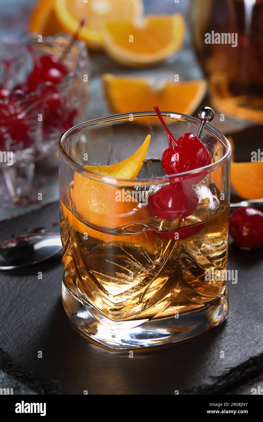 The Irish redhead. The cocktail is made from whiskey, grenadine syrup, soda water, lemon or lime juice, garnished with cherry garnish and orange zest, Stock Photo