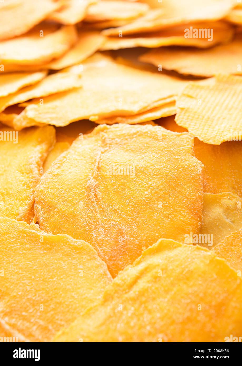 Dried large sweet mango slices on white background.Macro Stock Photo