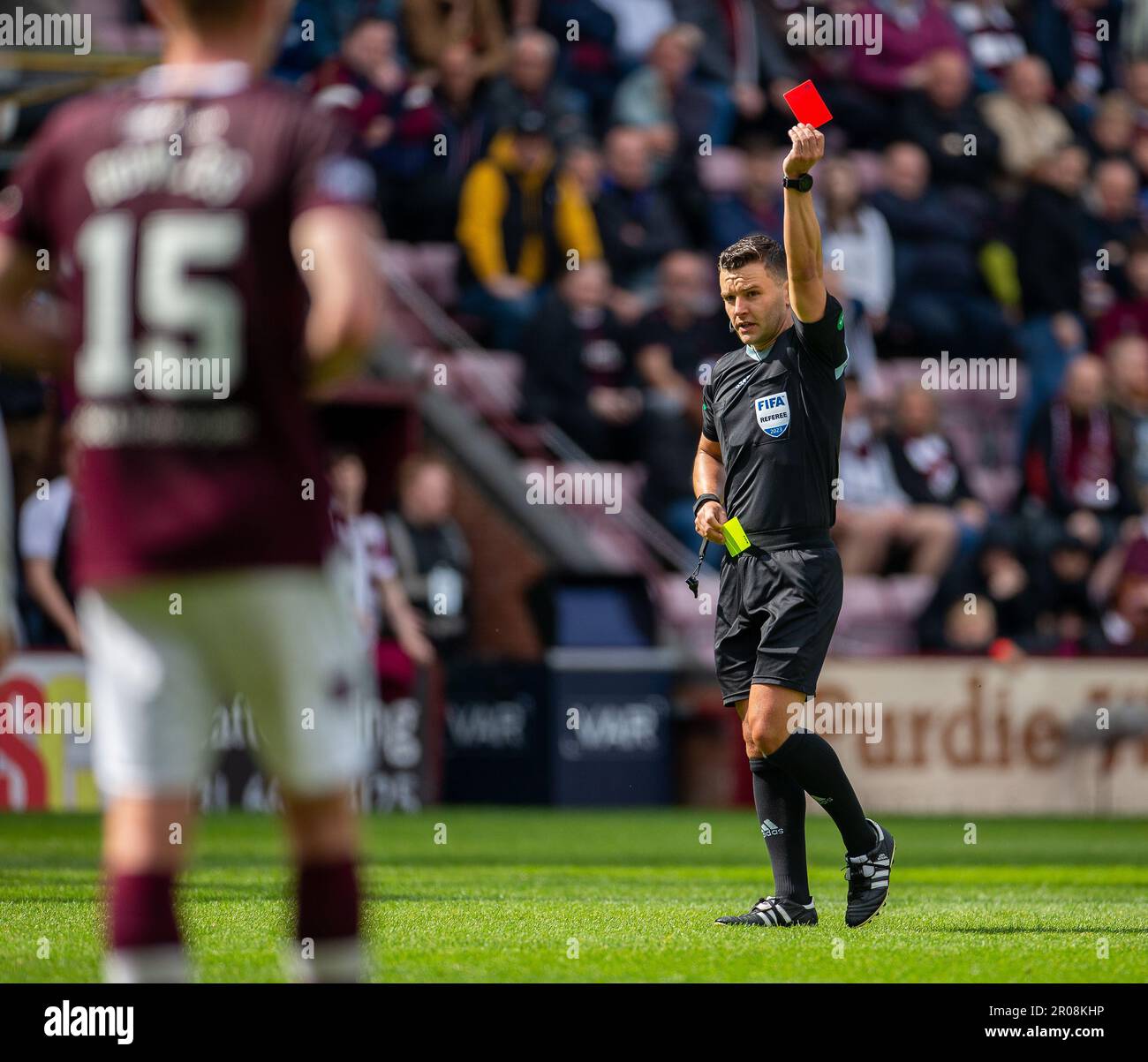 Edinburgh, UK. 07th May, 2023. 7th May 2023;  Tynecastle Park, Edinburgh, Scotland: Scottish Premiership Football, Hearts versus Celtic; Referee Nick Walsh shows Alex Cochrane of Heart of Midlothian the red card after a VAR check and sends him off Credit: Action Plus Sports Images/Alamy Live News Stock Photo