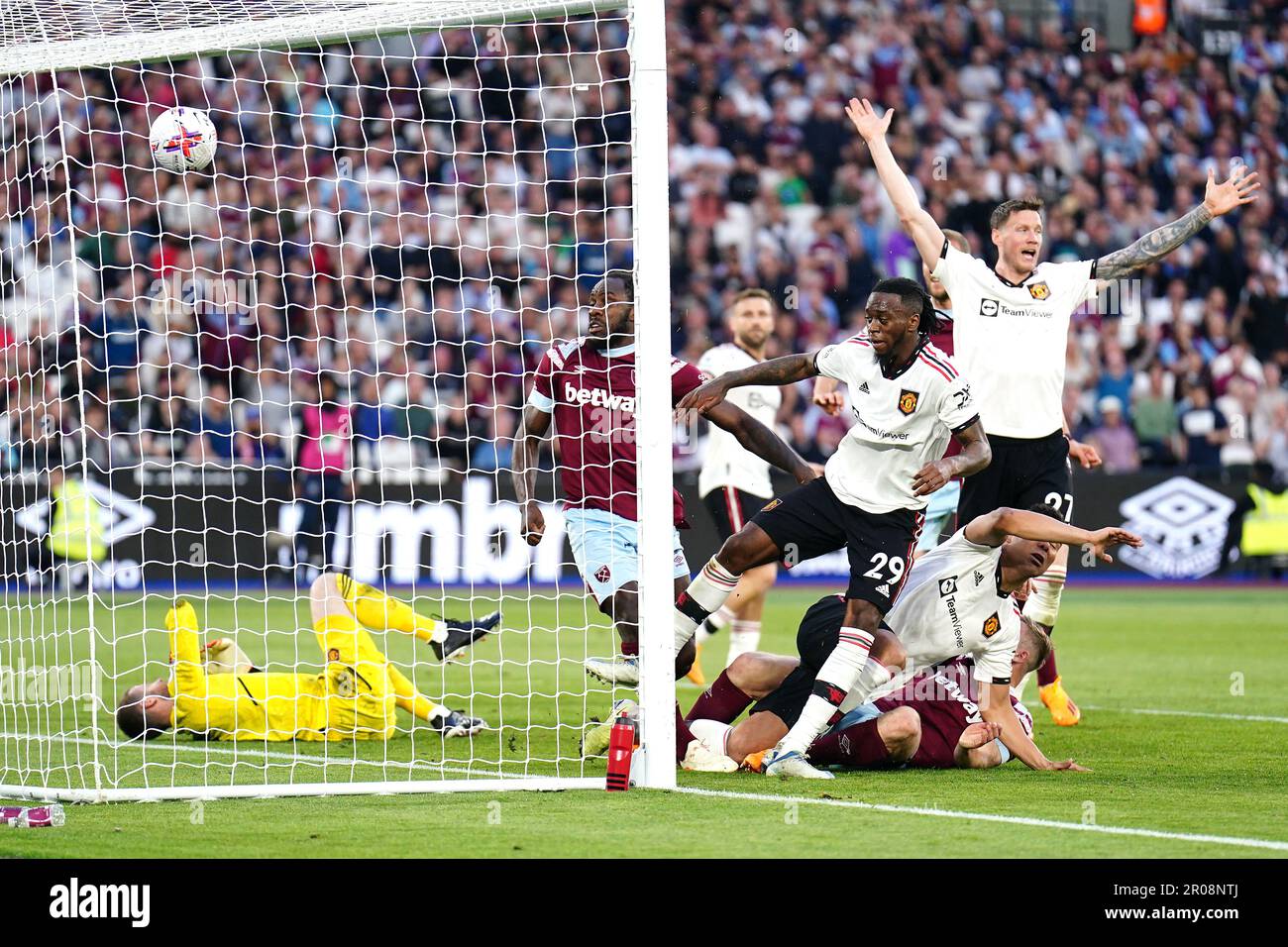 West Ham United score their second goal of the game before being ruled out for a foul on Manchester United goalkeeper David de Gea (left) during the Premier League match at the London Stadium. Picture date: Sunday May 7, 2023. Stock Photo