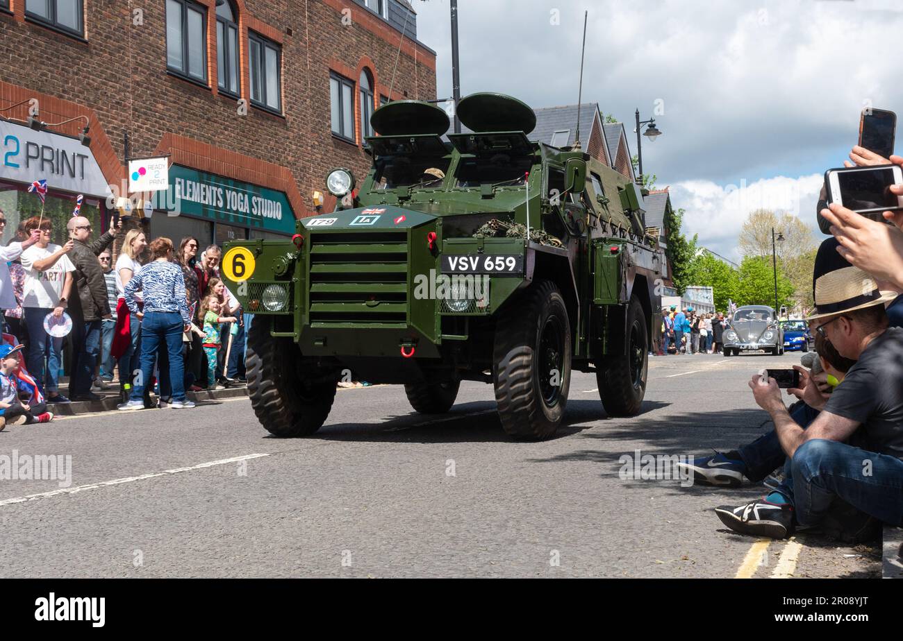 May 7th, 2023. Fleet, Hampshire, England, UK. The long weekend of festivities for the Coronation of King Charles III and Queen Camilla continued with a procession of classic cars and supercars along Fleet Road. This was followed by a Coronation Parade involving marching bands and community organisations.  It was a sunny afternoon for the popular event, which attracted lots of people to watch and celebrate the royal occasion. Stock Photo