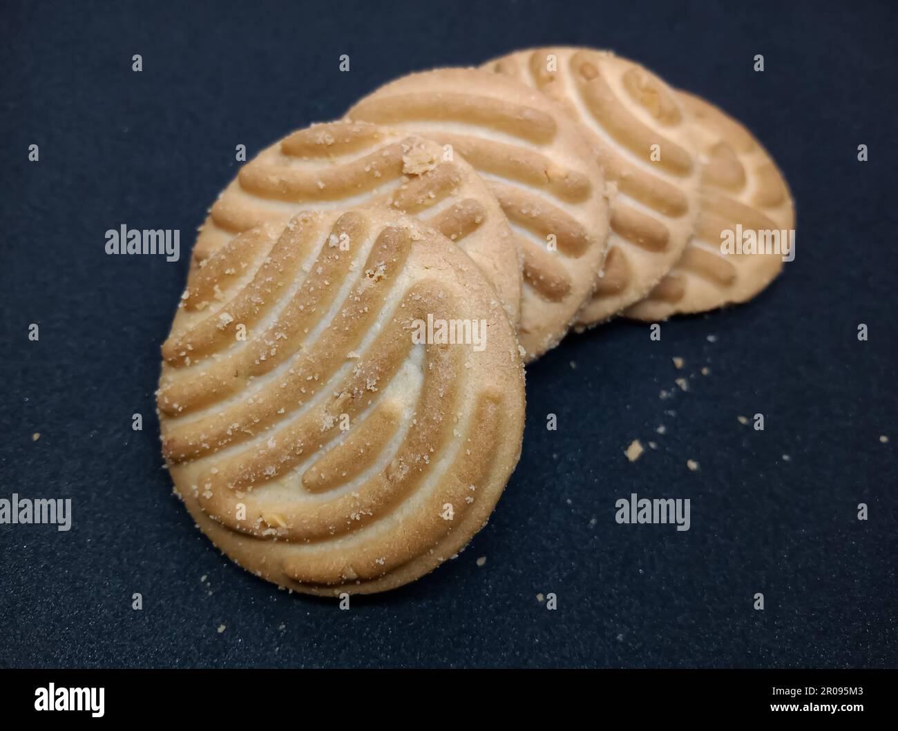 Round shape Indian biscuits on black background popularly known as Chai
