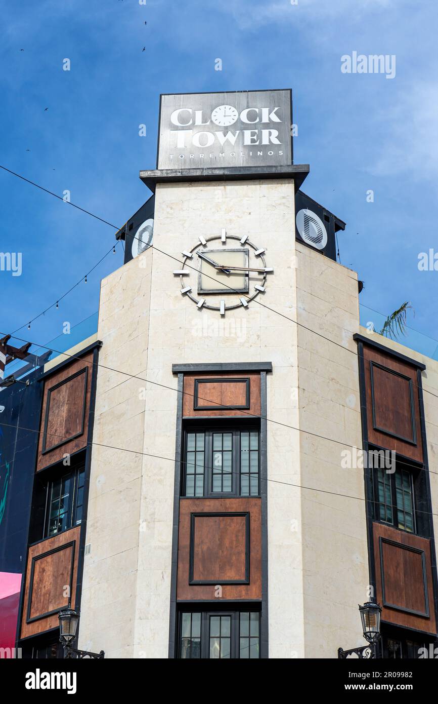 TORREMOLINOS, SPAIN MAY 4, 2023 Clock tower restaurant in city