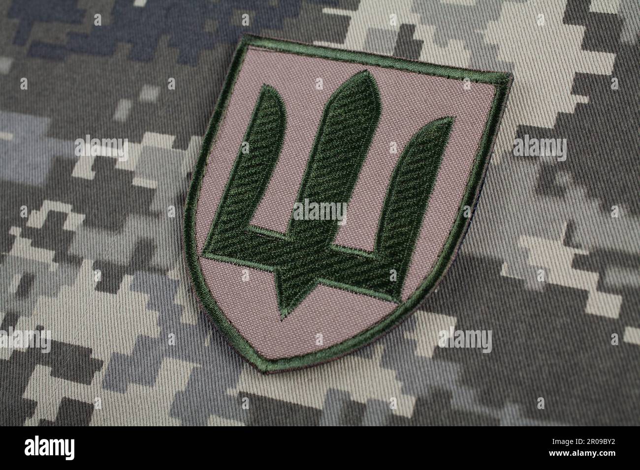 KYIV, UKRAINE - October 5, 2022. Russian invasion in Ukraine 2022. Ukraine Army uniform shoulder sleeve insignia badge on camouflaged uniform backgrou Stock Photo