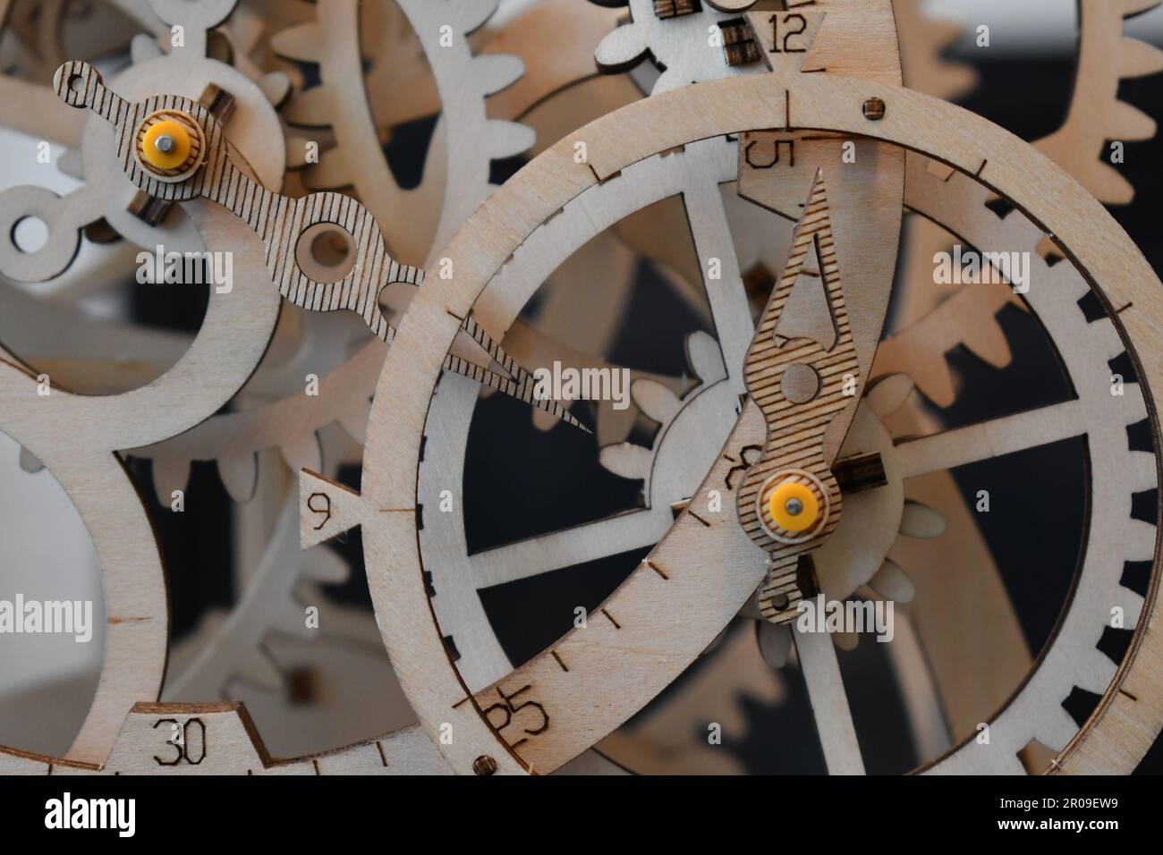 A wooden mechanical clock with exposed gears Stock Photo Alamy