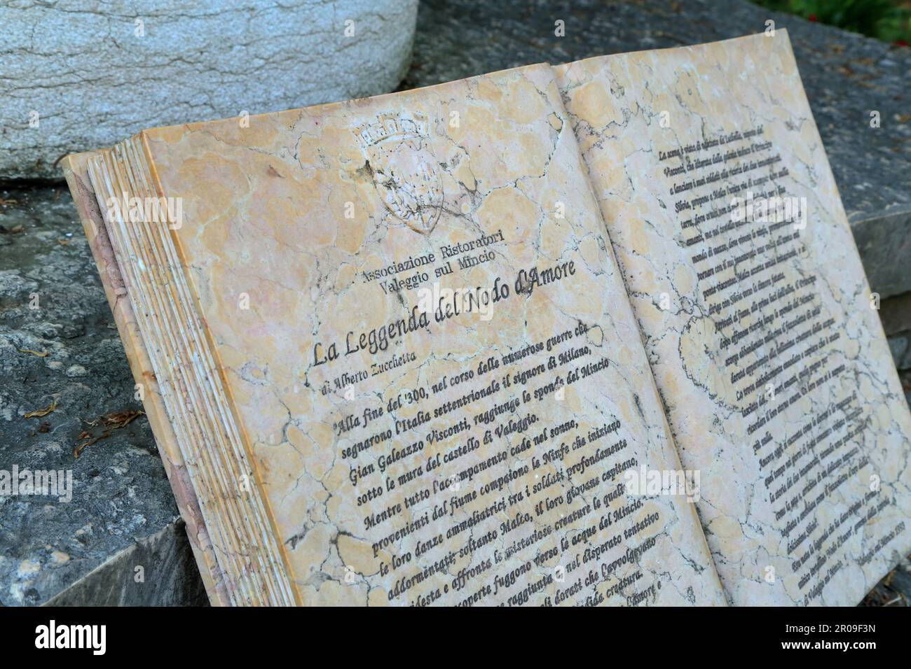 Stone book sculpture of The legend of the Love Knot (La Leggenda del Nodo d'Amore). Valeggio sul Mincio, Italy. Stock Photo