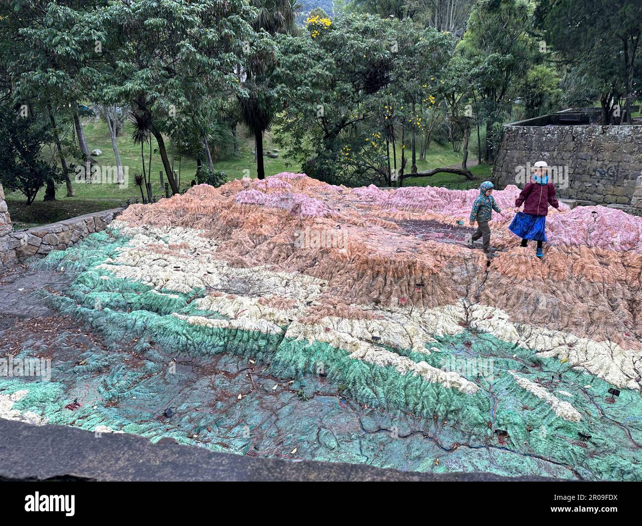 February 16, 2023, BogotÃ, USA: A large scale topographical model of BogotÃ¡ and its environs is in the Parque Nacional in BogotÃ¡, Colombia. The city is the dark valley between the mountains in the model, which the children are walking through. (Credit Image: © Mark Hertzberg/ZUMA Press Wire) EDITORIAL USAGE ONLY! Not for Commercial USAGE! Stock Photo