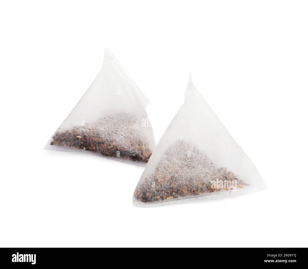 New pyramid tea bags on white background Stock Photo Alamy