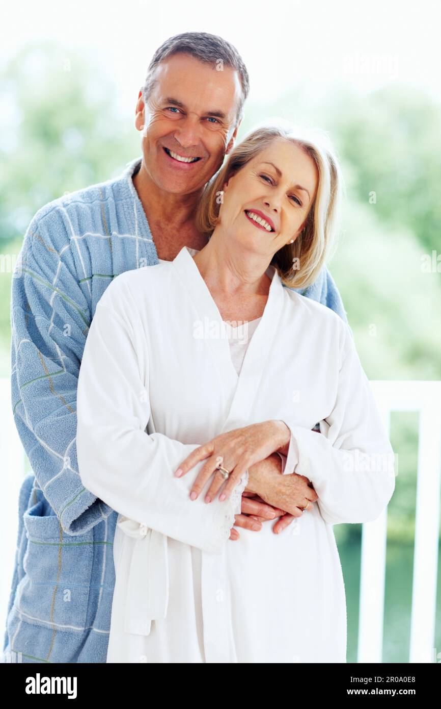 Loving mature man embracing woman from back. Portrait of a loving ...