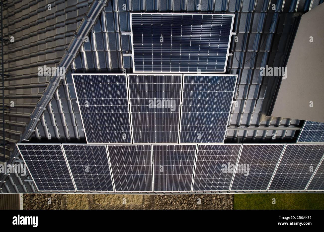 Building Generating Effect Aerial view of residential building with solar modules for generating ...