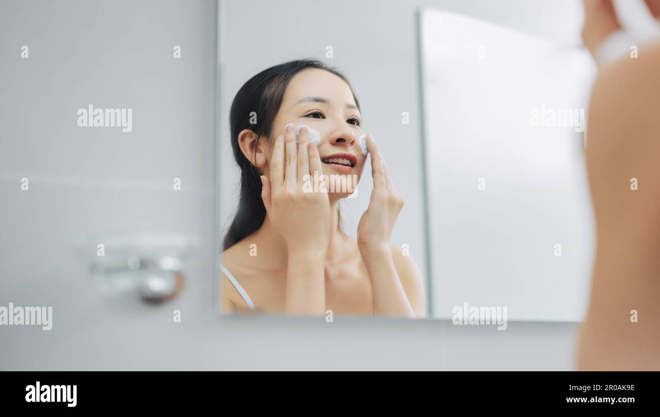 Woman water face cleaning hi-res stock photography and images - Alamy