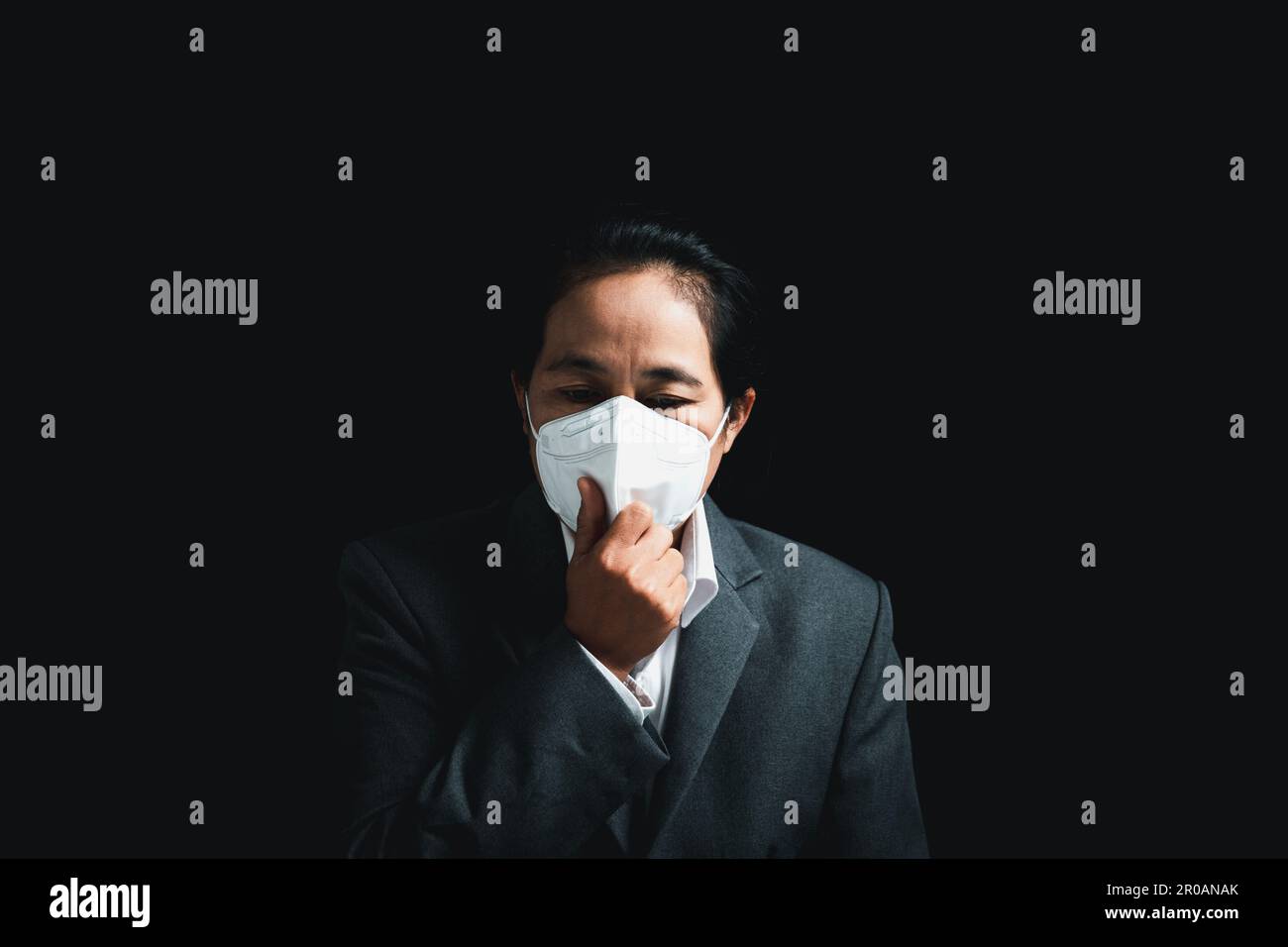 Woman wearing N95 PM 2.5 respiratory protection mask against air