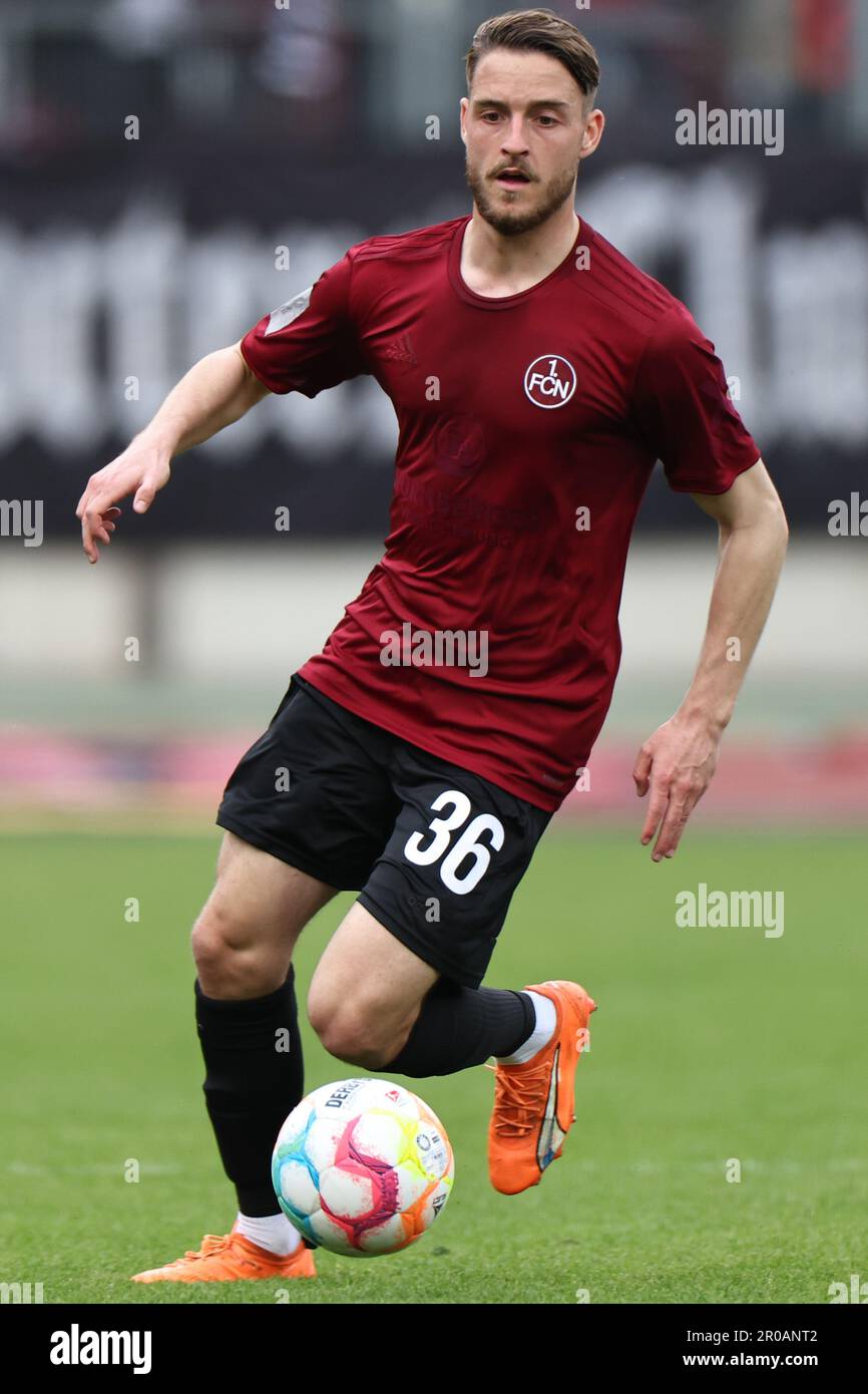 Nuremberg, Germany. 07th May, 2023. Soccer: 2nd Bundesliga, 1. FC Nuremberg - 1. FC Kaiserslautern, Matchday 31 at Max Morlock Stadium. Nuremberg's Lukas Schleimer plays the ball. Credit: Daniel Karmann/dpa - IMPORTANT NOTE: In accordance with the requirements of the DFL Deutsche Fußball Liga and the DFB Deutscher Fußball-Bund, it is prohibited to use or have used photographs taken in the stadium and/or of the match in the form of sequence pictures and/or video-like photo series./dpa/Alamy Live News Stock Photo