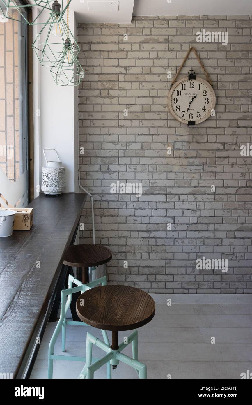 Beautiful rustic clock hung on a brick wall in vintage style Stock ...