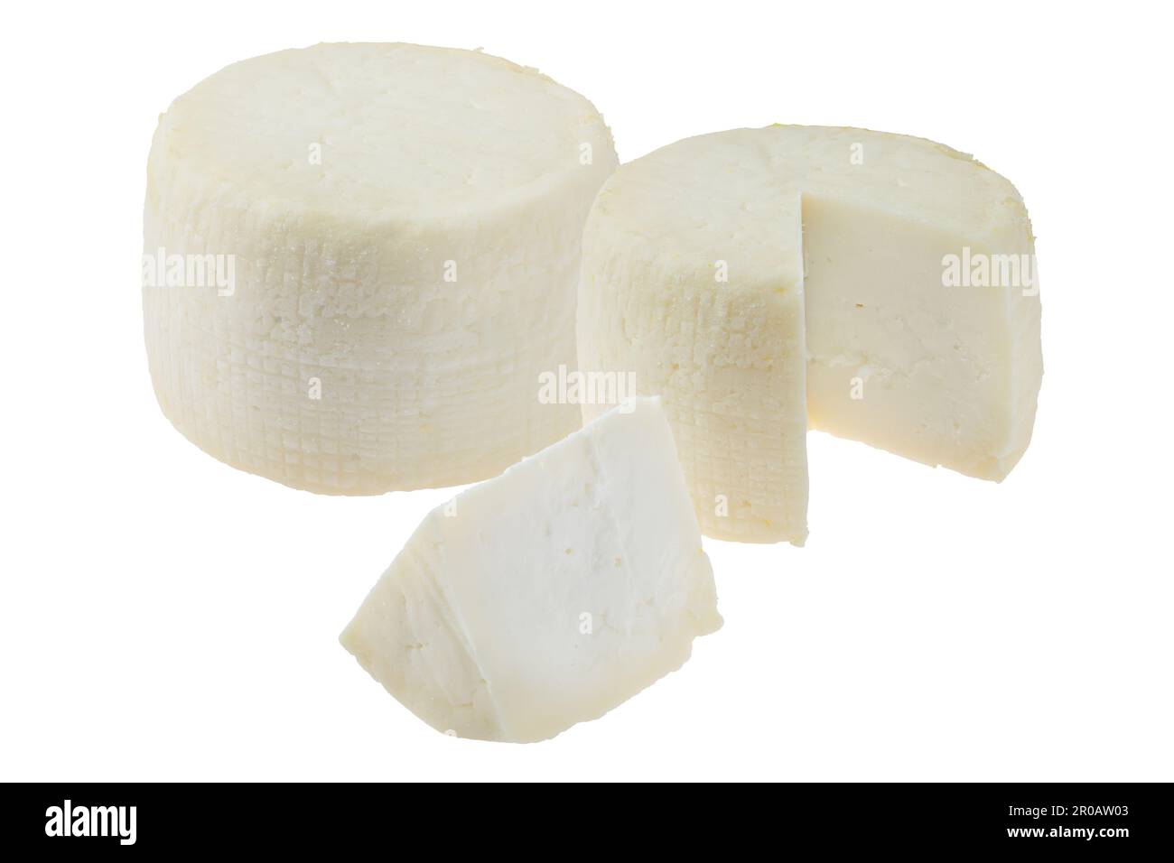 Two heads of goat cheese whole and cut isolated on white background Stock Photo