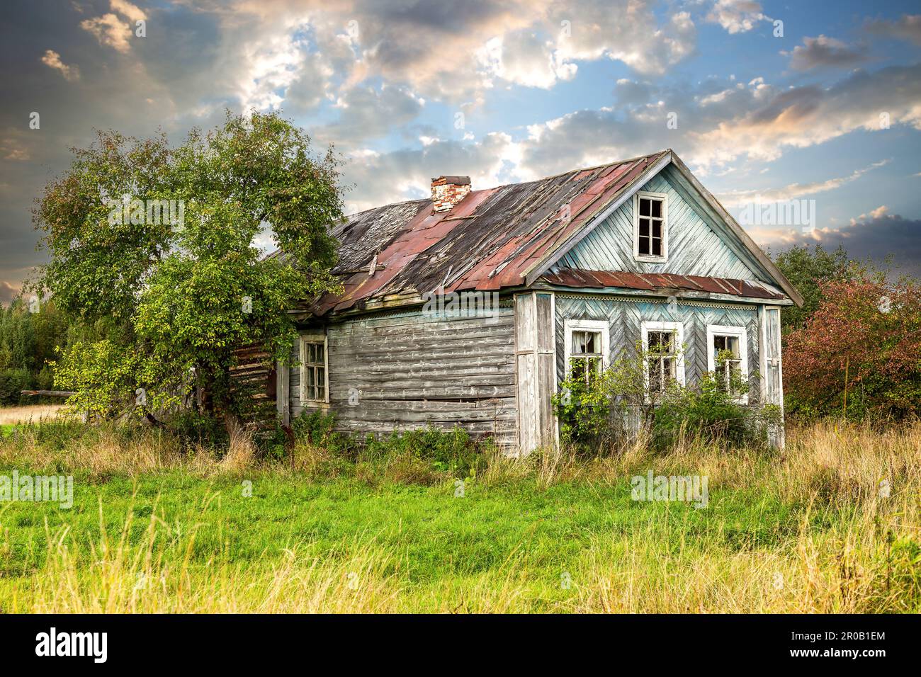 Old abandoned rural wooden house in russian village in summer sunny day ...