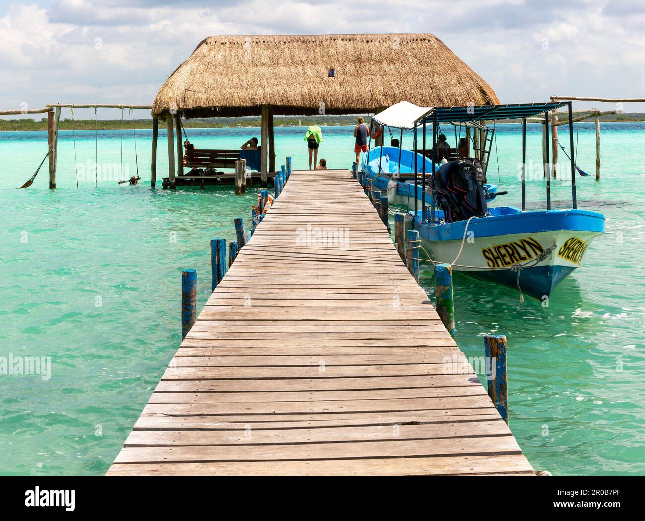 Cabana thatched cabin on wooden jetty pier, Lake Bacalar, Bacalar, Quintana Roo, Yucatan