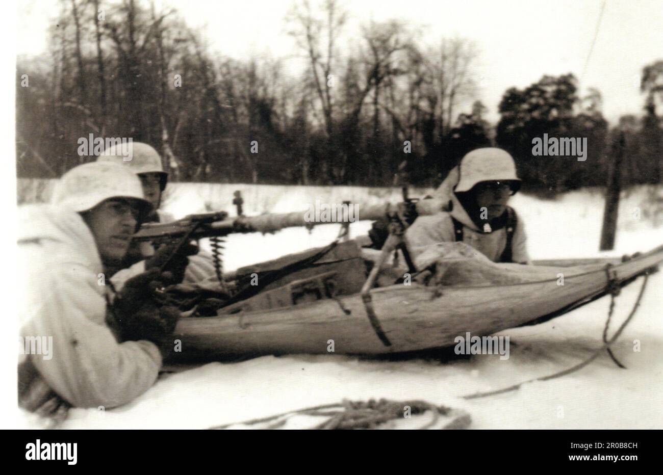 World War Two B&W photo German Troops with a MG34 on a sled in the Winter of 1941/42 . Stock Photo