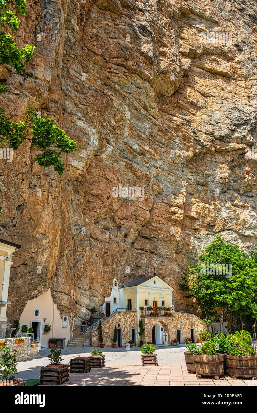 The Sanctuary of the Holy Trinity in Vallepietra and the rocky wall above. Vallepietra, Lazio, Italy, Europe Stock Photo