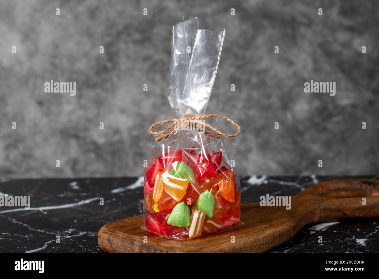 Fruit drops. Packed fruit flavored candy on a dark background Stock