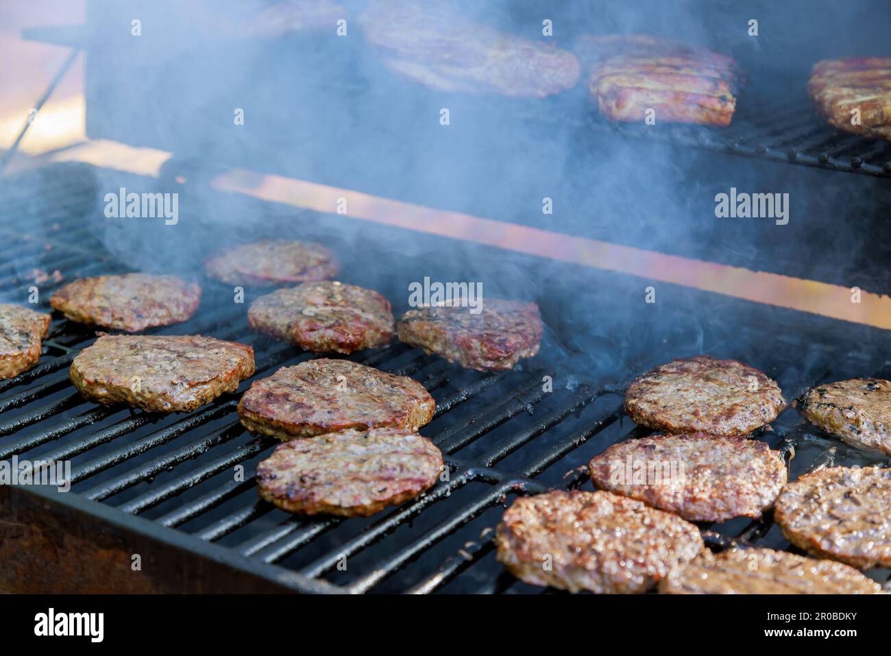 Using hot grill is grilled to perfection American beef burger Stock