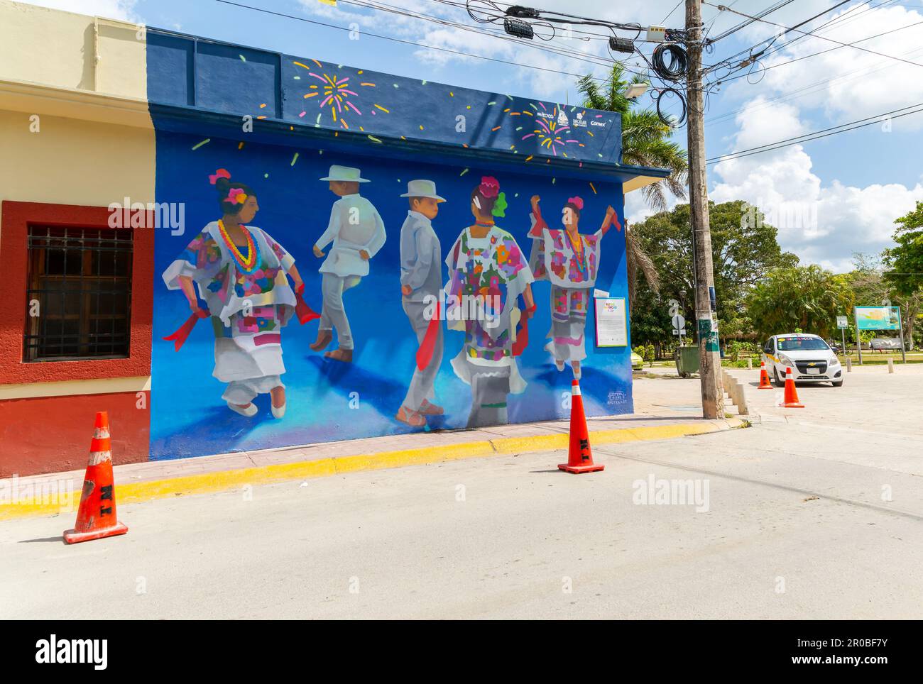 Mayan dancers mural on street corner wall in town centre, Bacalar, Quintana Roo, Yucatan Peninsula, Mexico Stock Photo