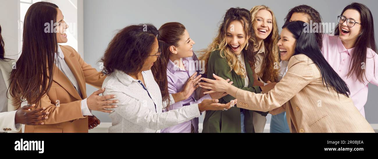 Group of happy diverse women hugging and congratulating their friend ...