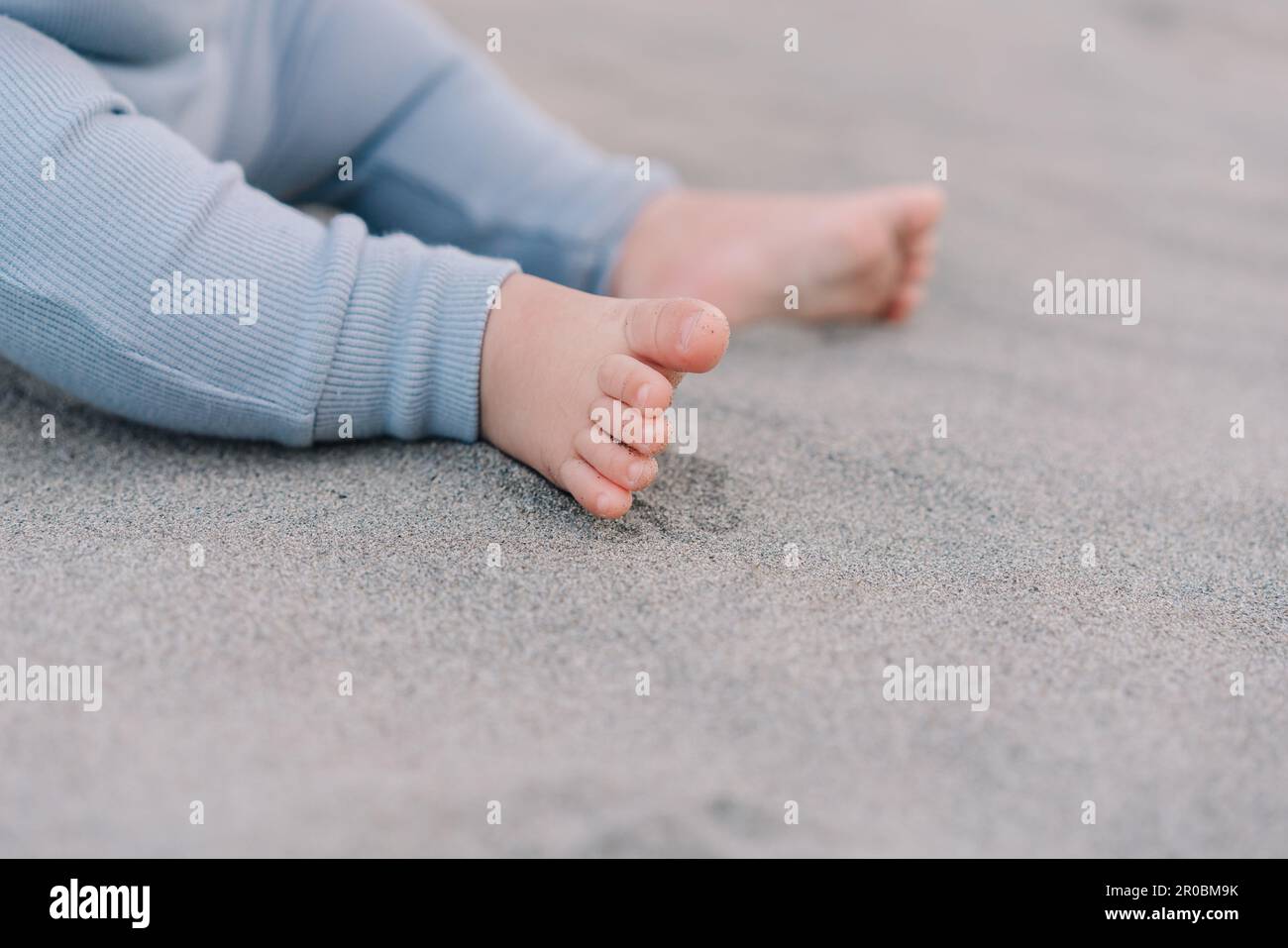 Barefoot baby feet on the sand Stock Photo Alamy
