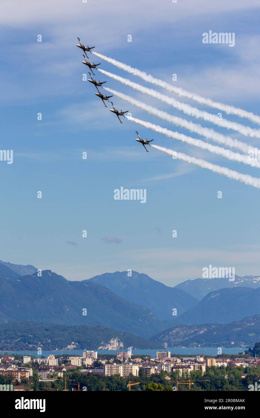 Breitling jet team formation over a lake with smoke trail Stock Photo
