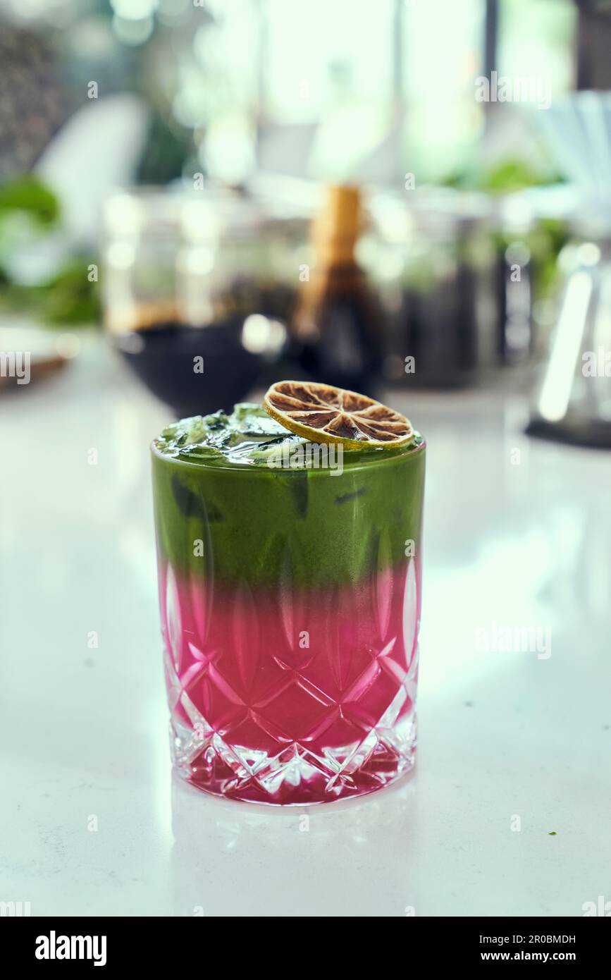 A prickly pear, matcha green tea, lemonade beverage at a coffee shop. Stock Photo