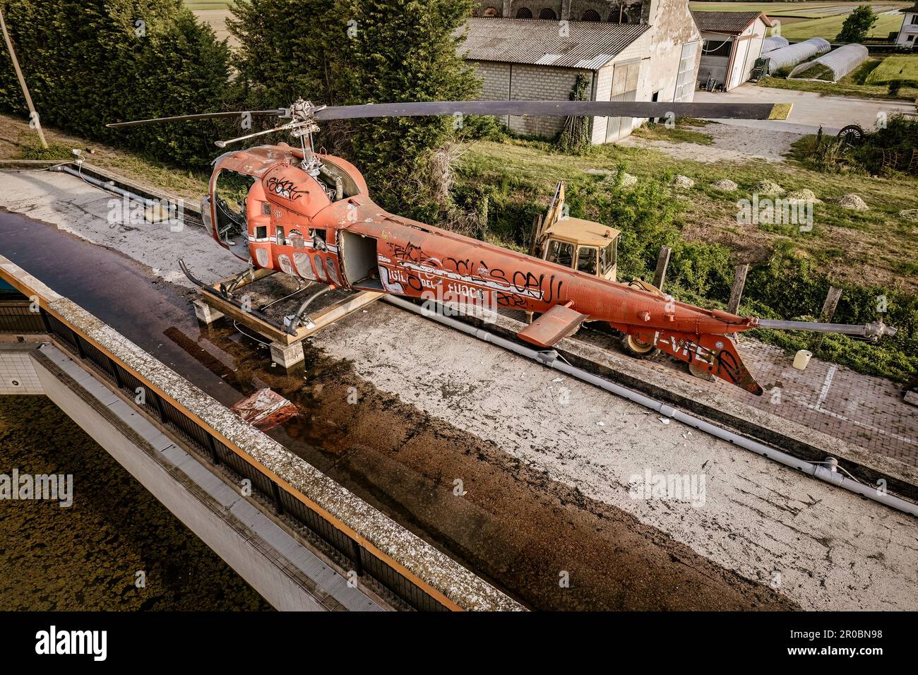 A striking image of an old helicopter left to decay and vandalized ...