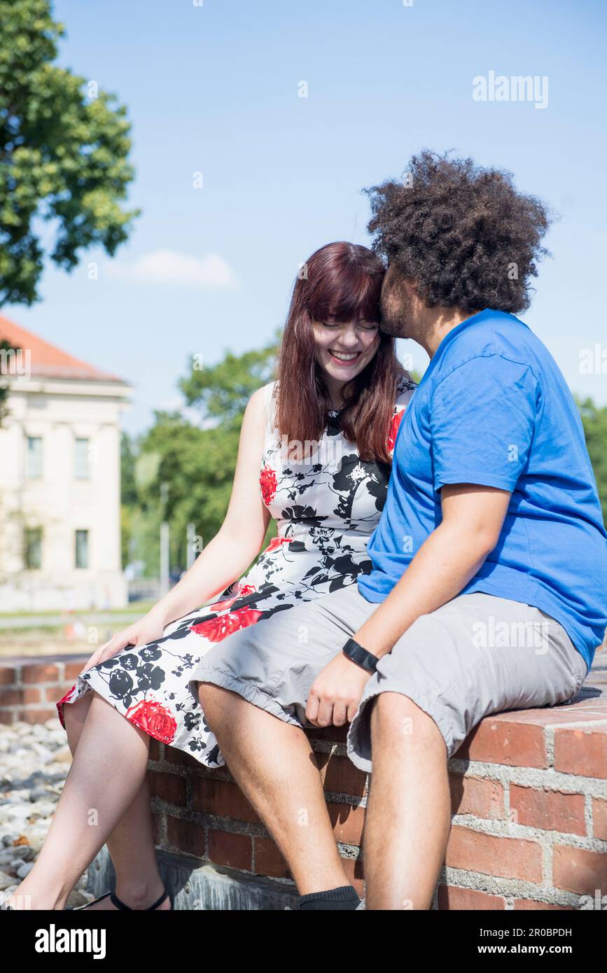 Relaxed young couple spending time outdoors Stock Photo