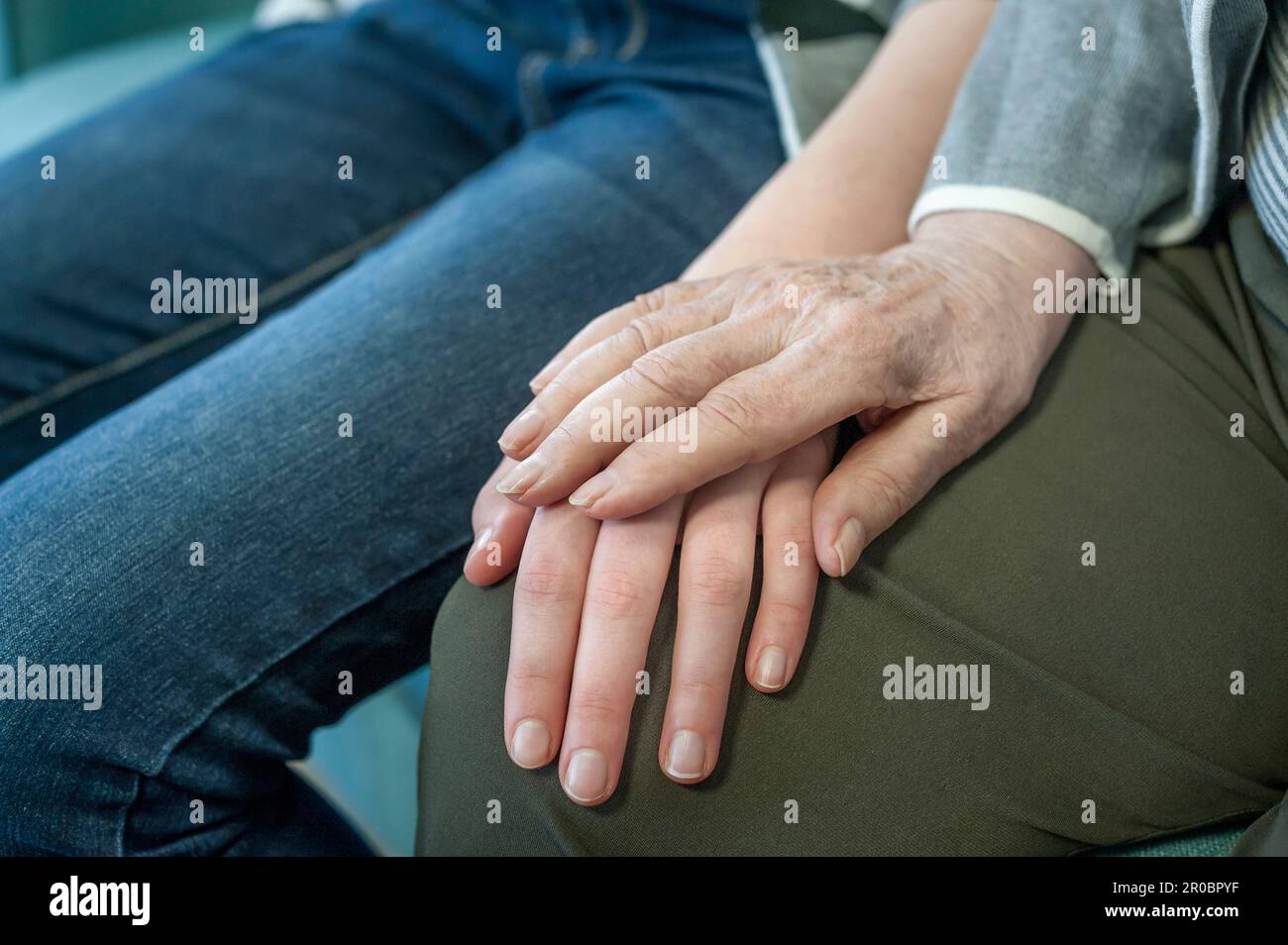 Senior woman holding hand of girl Stock Photo